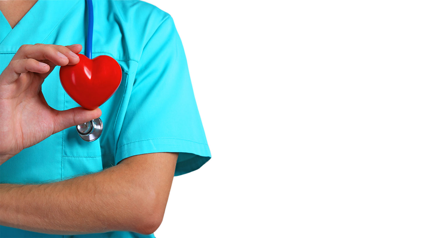Nurse wearing blue scrubs and stethoscope holding a red heart in their hand