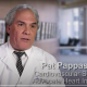 Dr. Pat Pappas in a white lab coat